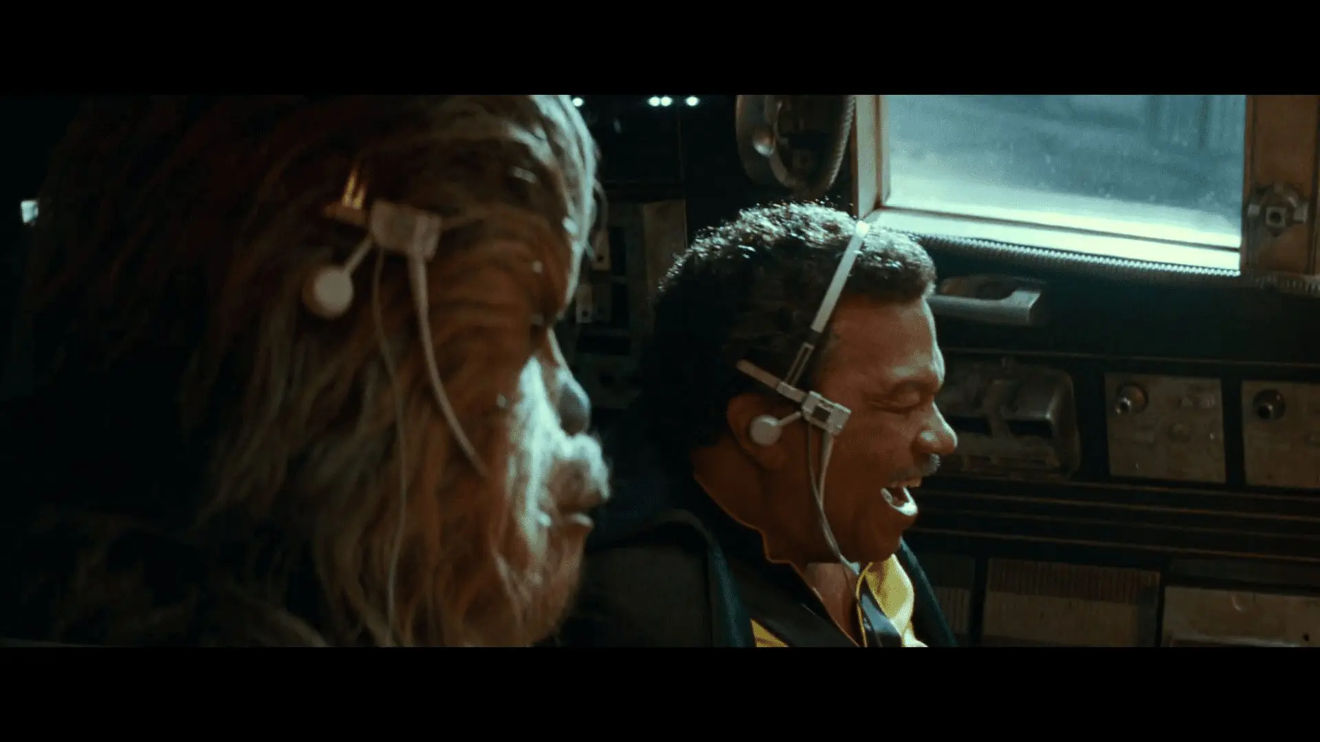Poe, Finn, and Chewie charging down a corridor