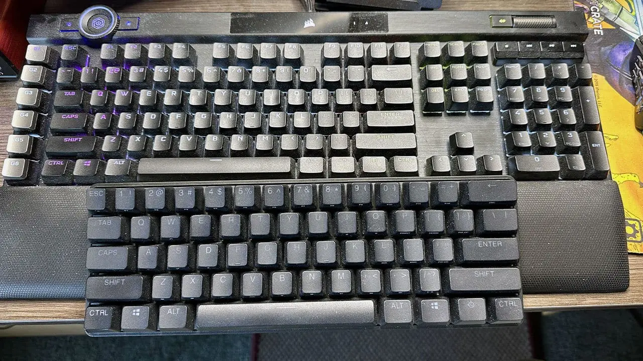 Apex Pro Mini compared to a full-size Corsair keyboard