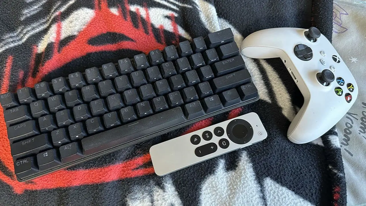 Apex Pro Mini keyboard size compared against TV remotes