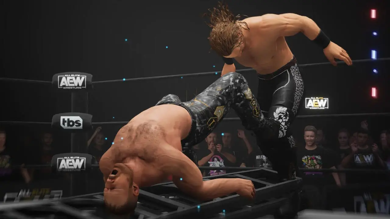 Ladder match spot featuring Moxley and Hangman Page