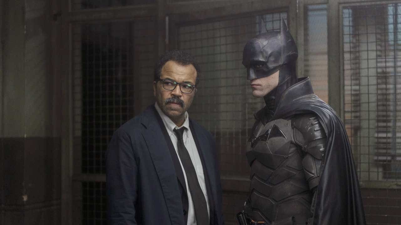 Robert Pattinson’s Batman silhouetted in red light