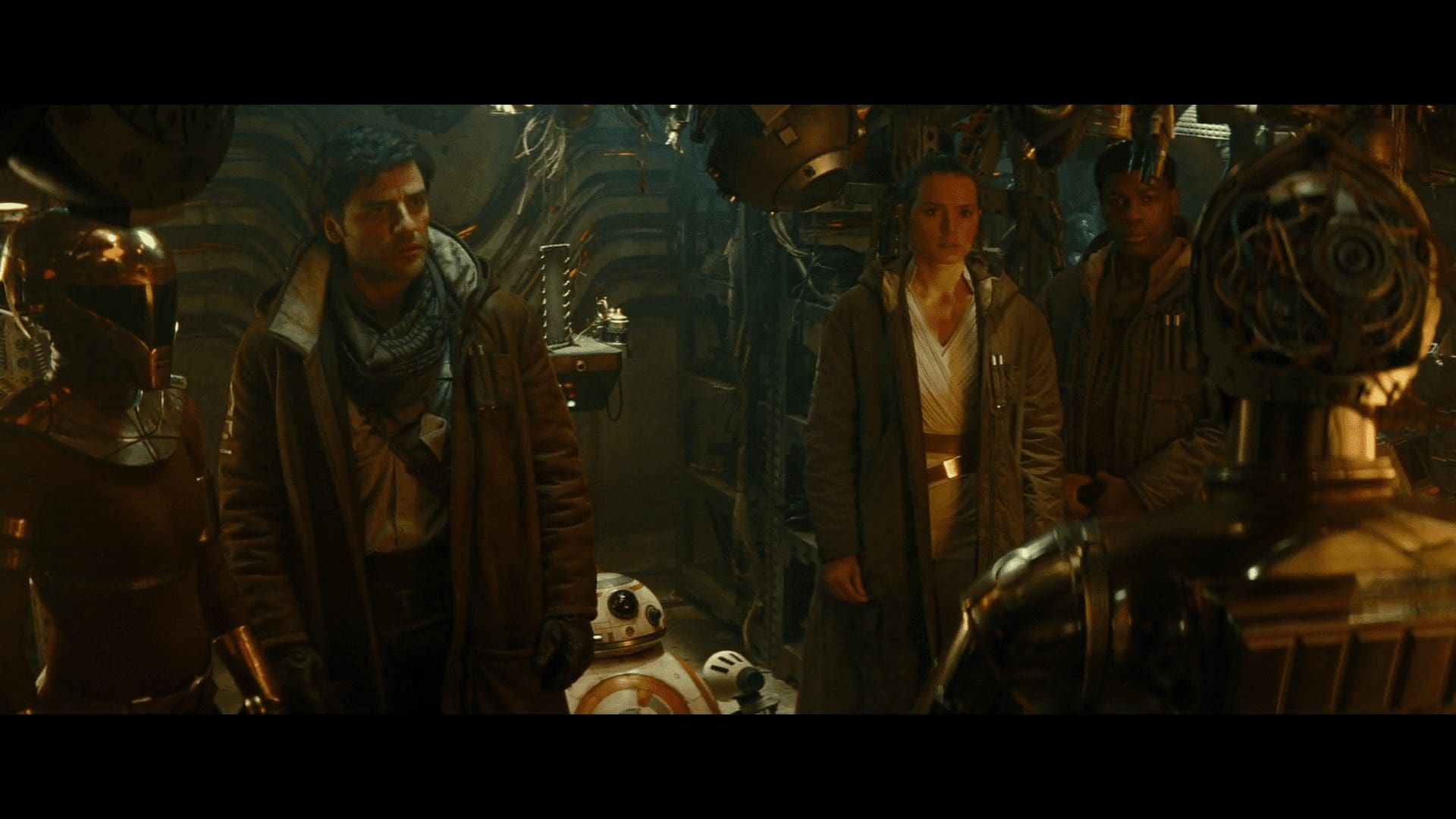 C-3PO turns to his friends in the droid workshop